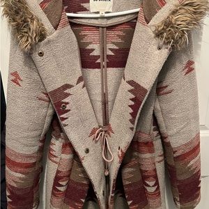 Winter coat with oversized hood. Polyester/wool blend.